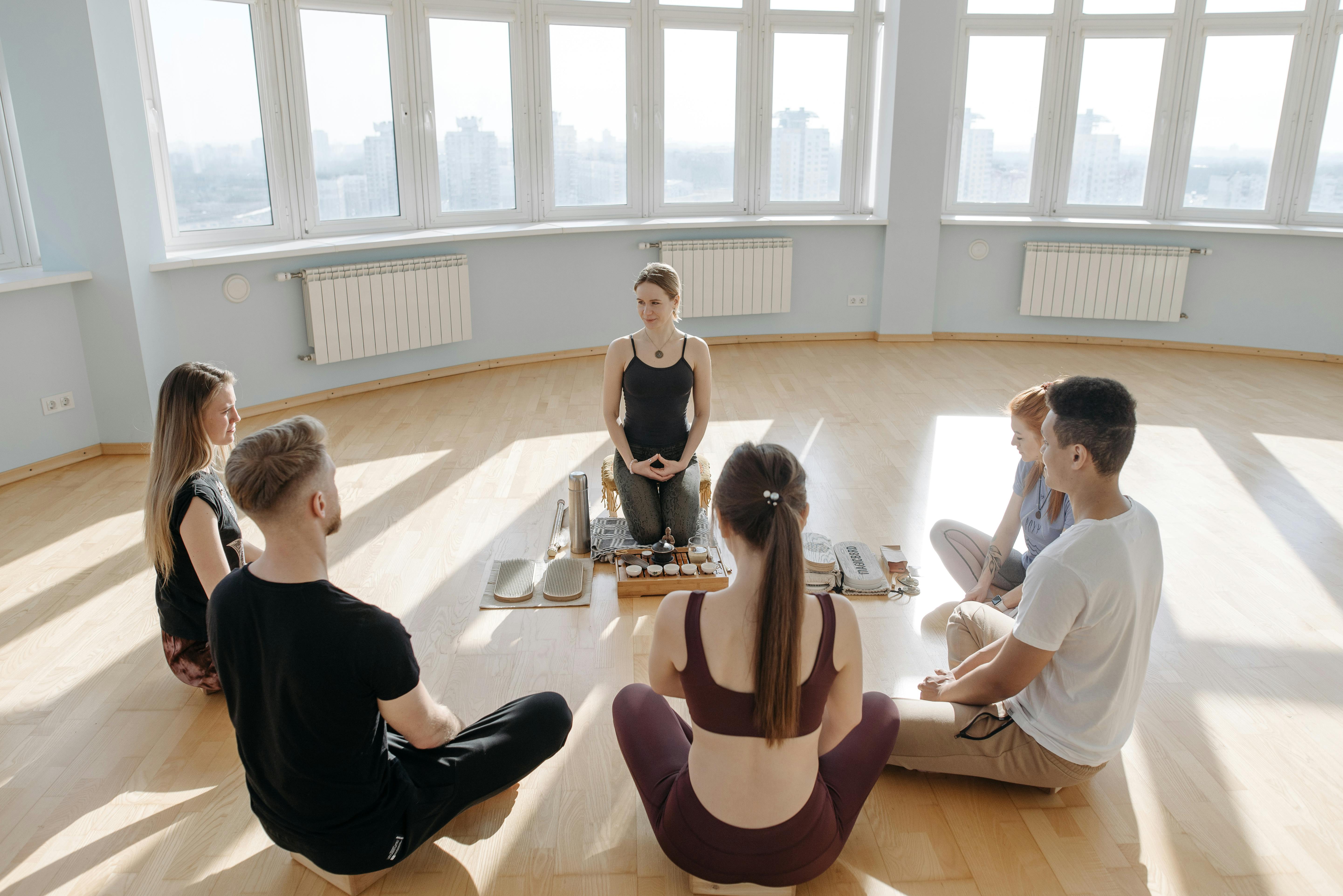 Image of a group of people in a wellness session.